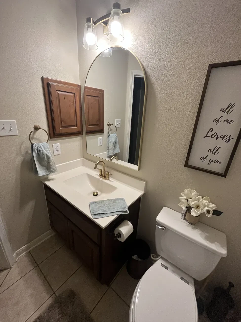 Clean, staged bathroom vanity with fresh towels